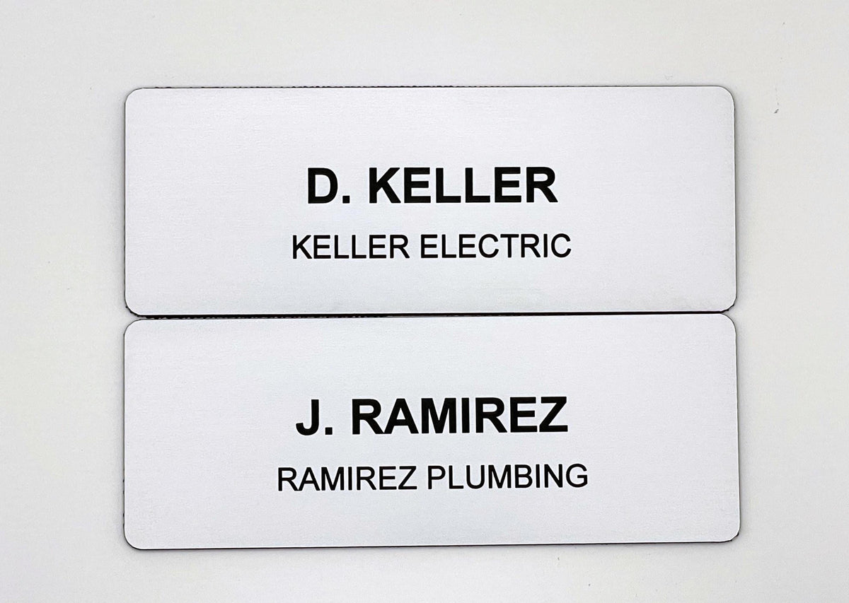 Two rectangular white name badges with rounded corners. The top badge features the black text D. KELLER and KELLER ELECTRIC. The bottom badge features the black text J. RAMIREZ and RAMIREZ PLUMBING. Both badges have a clean, professional design.