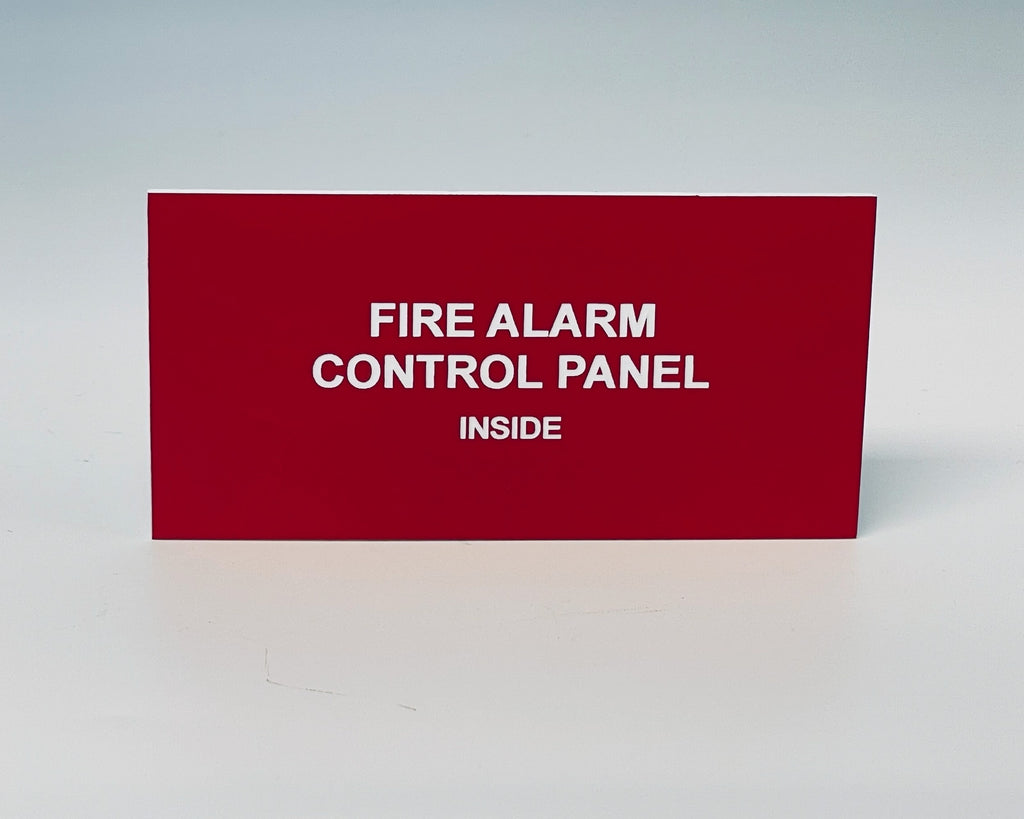 Red engraved placard with white letters reading FIRE ALARM CONTROL PANEL, INSIDE.