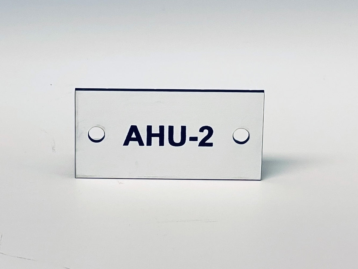 White engraved tag with two screw holes, black letters reading AHU-2.