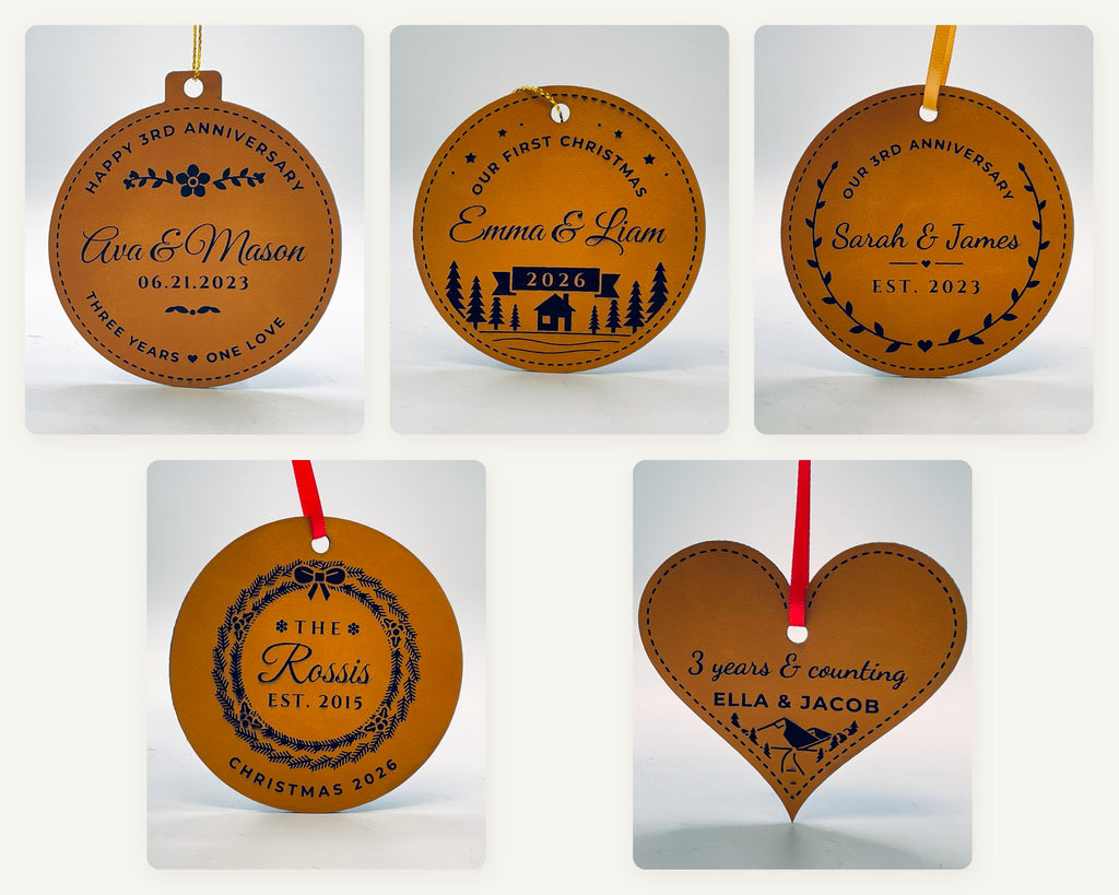 Five rawhide leatherette Christmas ornaments, each engraved in black: a happy 3rd anniversary bauble, an our first Christmas round with a pine forest, an our 3rd anniversary laurel round, a family name inside an evergreen wreath, and a 3 years and counting heart.