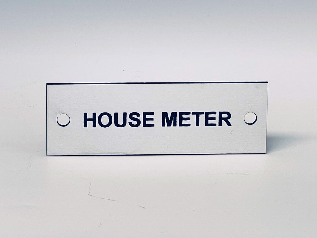 White engraved tag with two screw holes, black letters reading HOUSE METER.