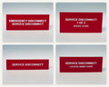The four engraved red labels in the service and emergency disconnect set: EMERGENCY DISCONNECT, SERVICE DISCONNECT; SERVICE DISCONNECT, 1 OF 2, SERVES: HOUSE; SERVICE DISCONNECT; SERVICE DISCONNECT, LOCATED UNDER COVER. Each label is shown in its own photo.