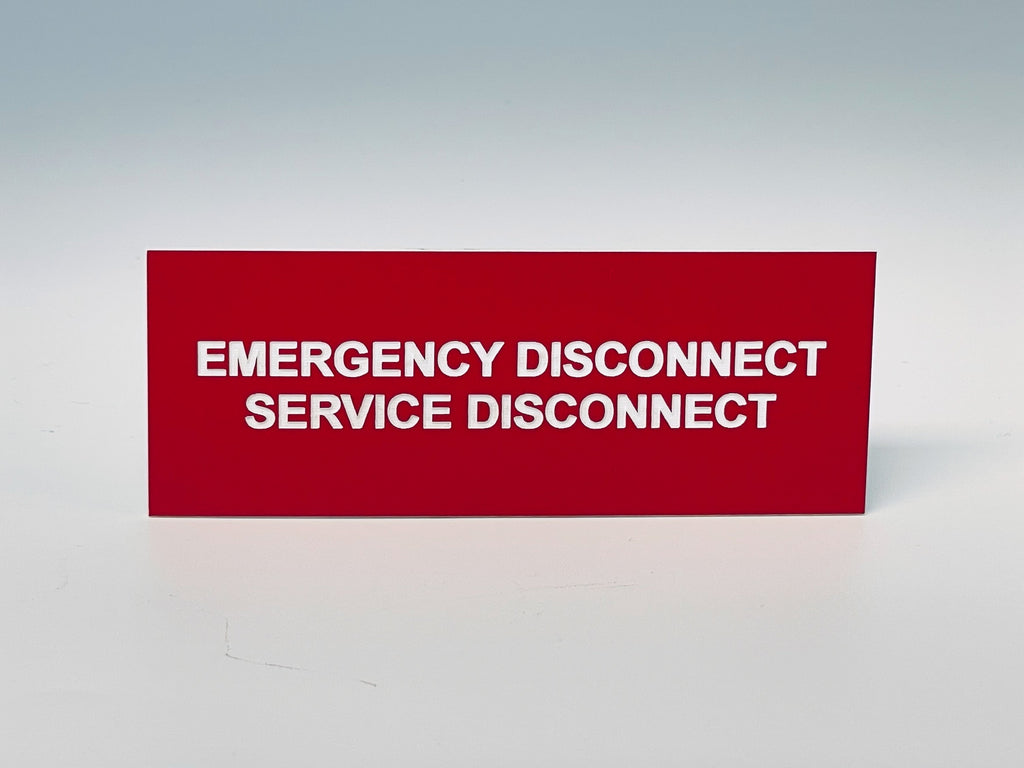 Red engraved label with white letters reading EMERGENCY DISCONNECT, SERVICE DISCONNECT.