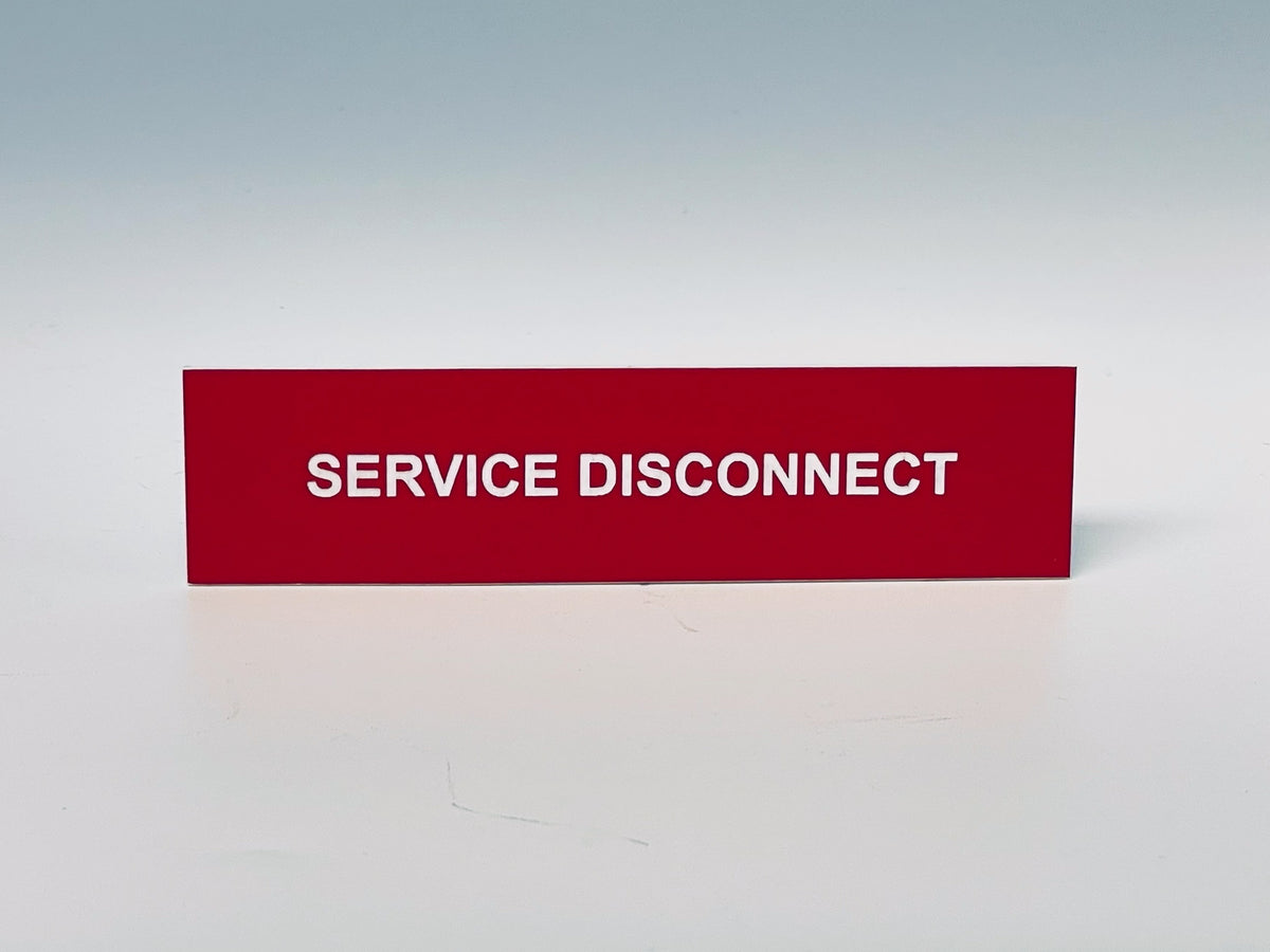 Red engraved label with white letters reading SERVICE DISCONNECT.