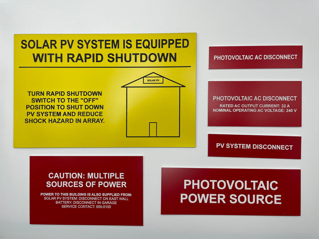 Solar PV label set: a yellow rapid shutdown placard with red photovoltaic disconnect, caution and power source labels.
