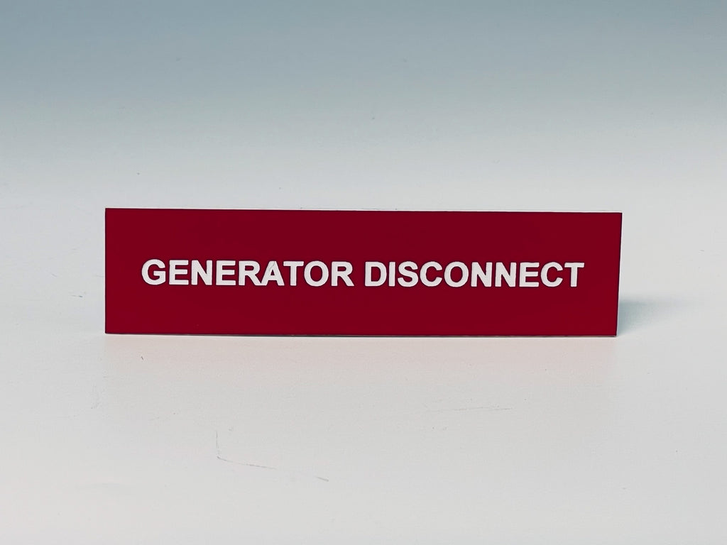 Red engraved label with white letters reading GENERATOR DISCONNECT.